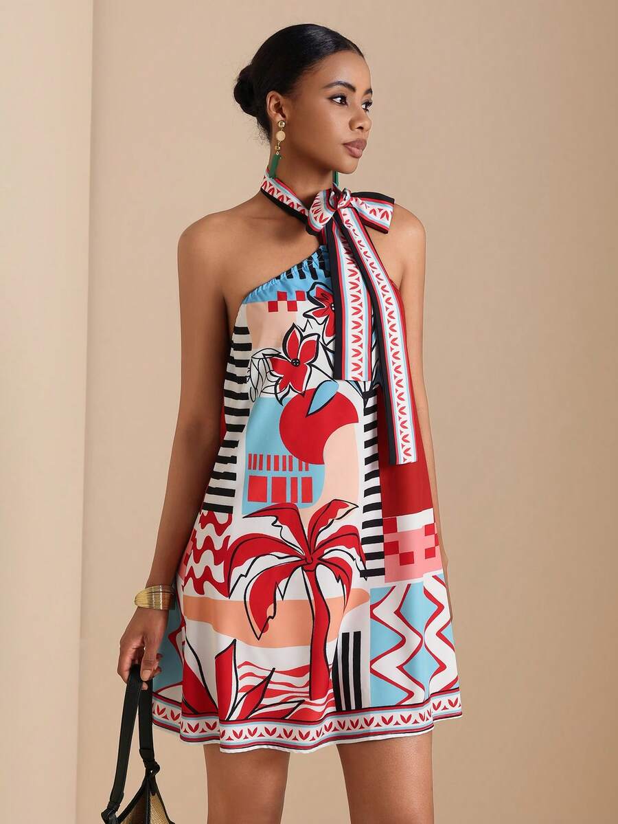 Full front view of red printed A-line halter dress with oversized bow and border hem
