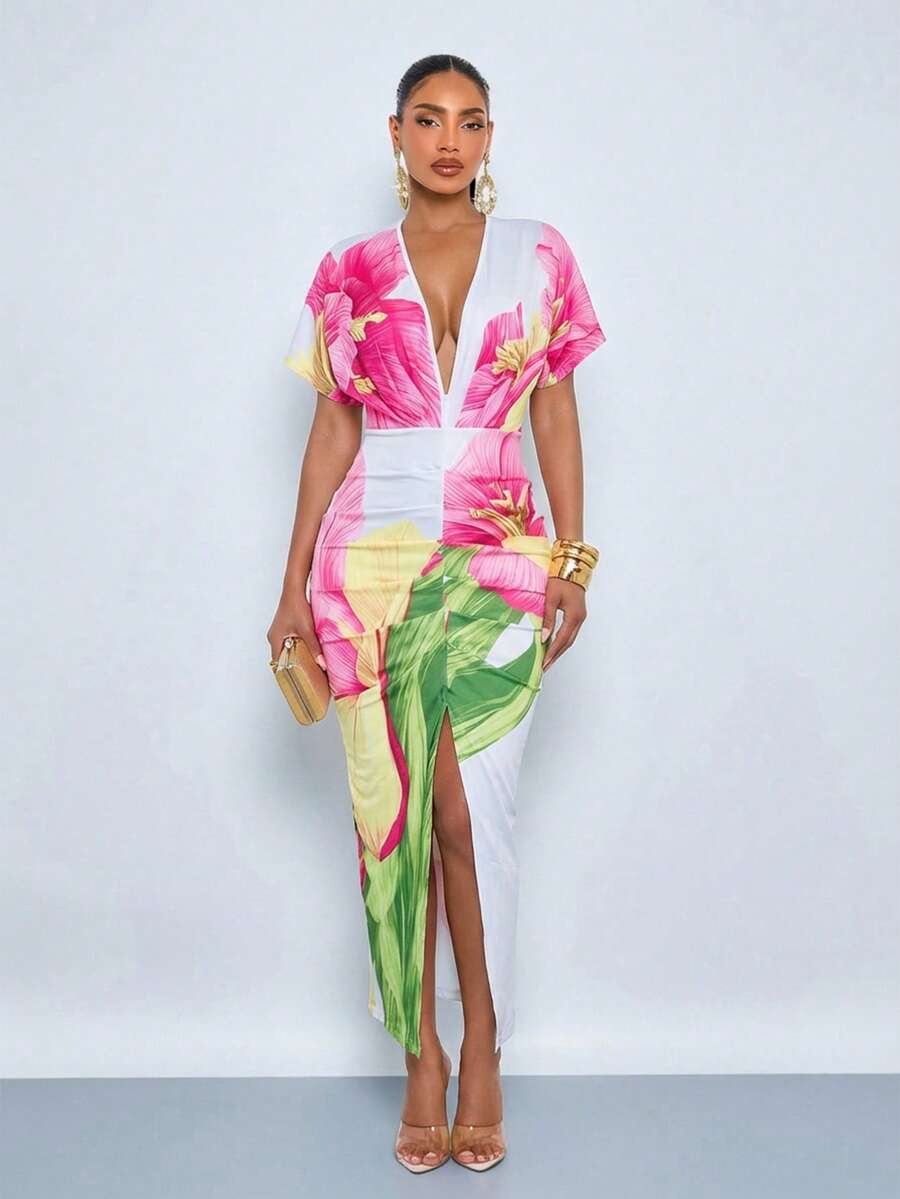 Front angled view of pink floral maxi dress with deep V neckline and high front slit