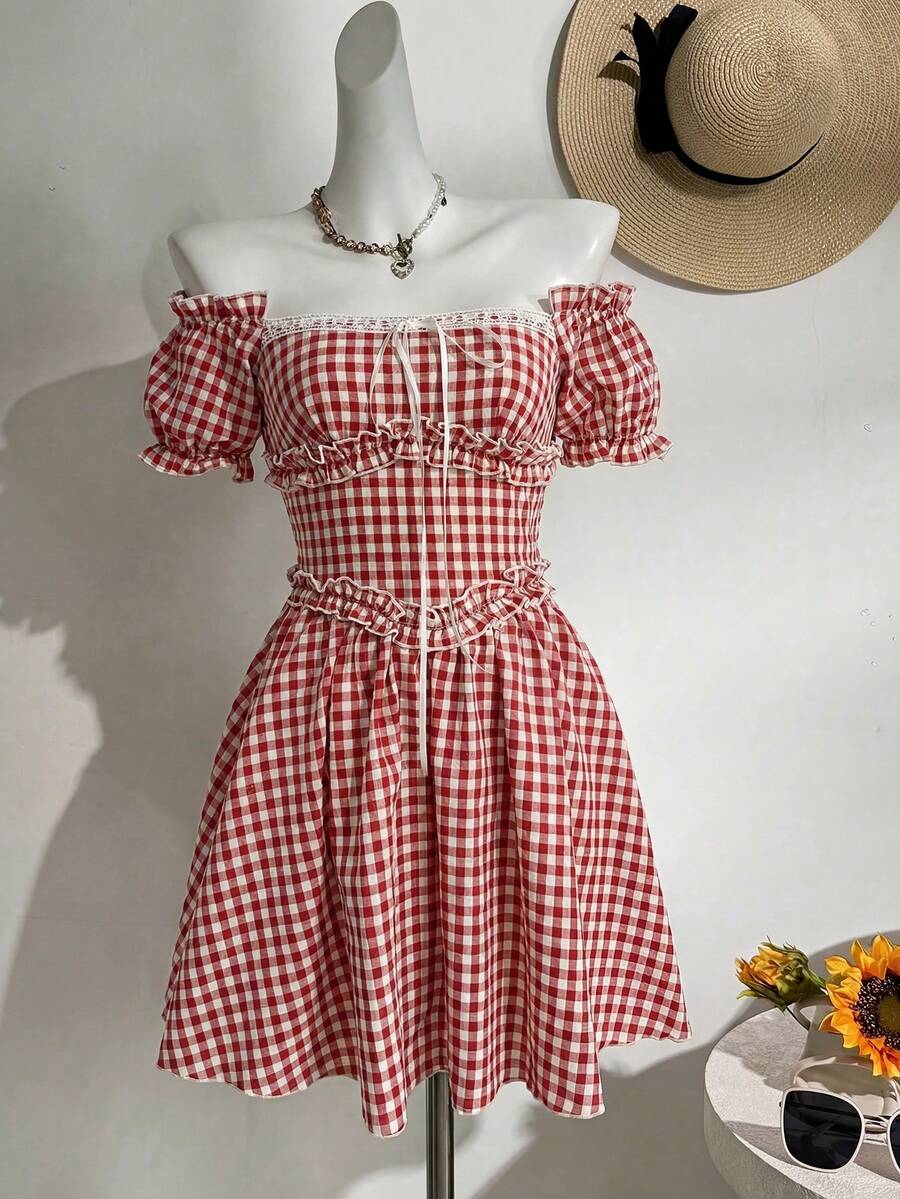 Embrace vintage charm with this enchanting gingham off-shoulder mini dress. Featuring a flattering A-line silhouette with puff sleeves, ruched bust detail, and a high waistline, it's the perfect piece for summer picnics and romantic garden gatherings. The red and white plaid pattern captures classic cottagecore aesthetics, while the flared hem adds playful movement. Crafted from a breathable cotton-polyester blend in a comfortable regular fit