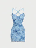 Front view of blue backless criss-cross mini dress for summer nights