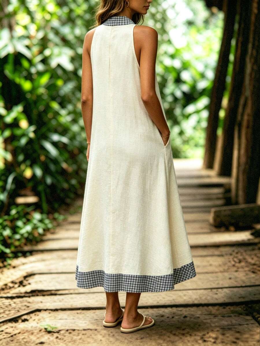 Cream halter maxi dress front view with gingham trim buttons and pocket