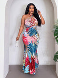 Back view of plus size tropical print maxi dress - sleeveless halter tie front for boho beach vacations and summer weddings with maxi dress silhouette, tropical print, plus size fit for summer casual wear