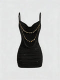 Apricot ruched cami mini dress with spaghetti straps and fitted silhouette