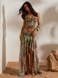 Front full view of green brown tropical print mesh bandeau crop top and flowing high-slit maxi skirt two-piece set for beach vacation styling