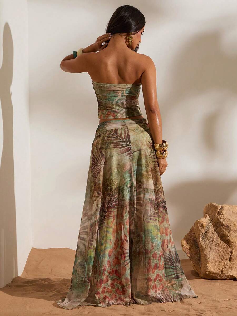 Back view of green brown tropical print ruched bandeau top and high-slit mesh maxi skirt two-piece set for beach vacation styling