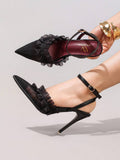 6 media show black pointed toe slingback stiletto heels with sheer mesh toe, organza ruffle frill across vamp, ankle strap, slingback strap, small round gold buckle, burgundy insole and thin dress sole. image 5