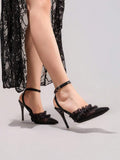 6 media show black pointed toe slingback stiletto heels with sheer mesh toe, organza ruffle frill across vamp, ankle strap, slingback strap, small round gold buckle, burgundy insole and thin dress sole. image 6