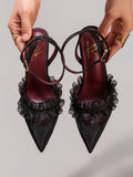 6 media show black pointed toe slingback stiletto heels with sheer mesh toe, organza ruffle frill across vamp, ankle strap, slingback strap, small round gold buckle, burgundy insole and thin dress sole. image 4
