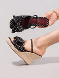 5 media show black polka dot wedge mule sandals with wide front bow strap, slim instep slip strap, burgundy insole, high braided jute espadrille wedge platform and brown outsole. image 4