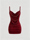 Burgundy bodycon mini dress with spaghetti straps and ruched fitted silhouette