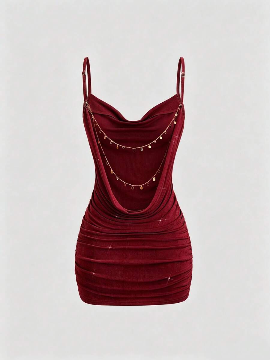 Burgundy bodycon mini dress with spaghetti straps and ruched fitted silhouette