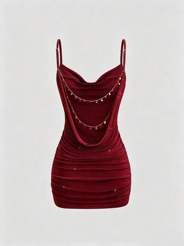 Burgundy bodycon mini dress with spaghetti straps and ruched fitted silhouette