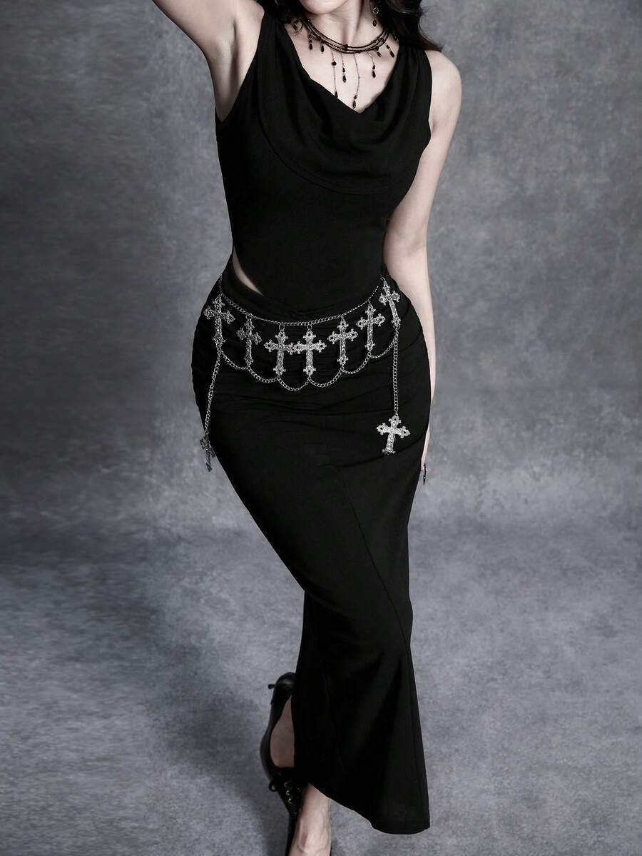 Close view of black draped cowl neckline and ruched asymmetric waist cutout