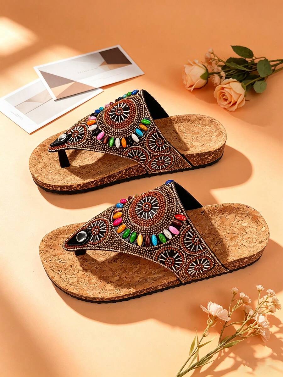 Side view of boho embellished sandals with low platform wedge sole and black tread