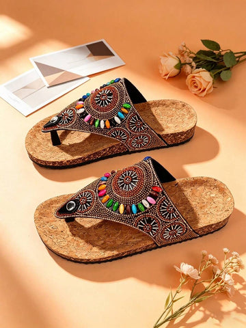 Side view of boho embellished sandals with low platform wedge sole and black tread