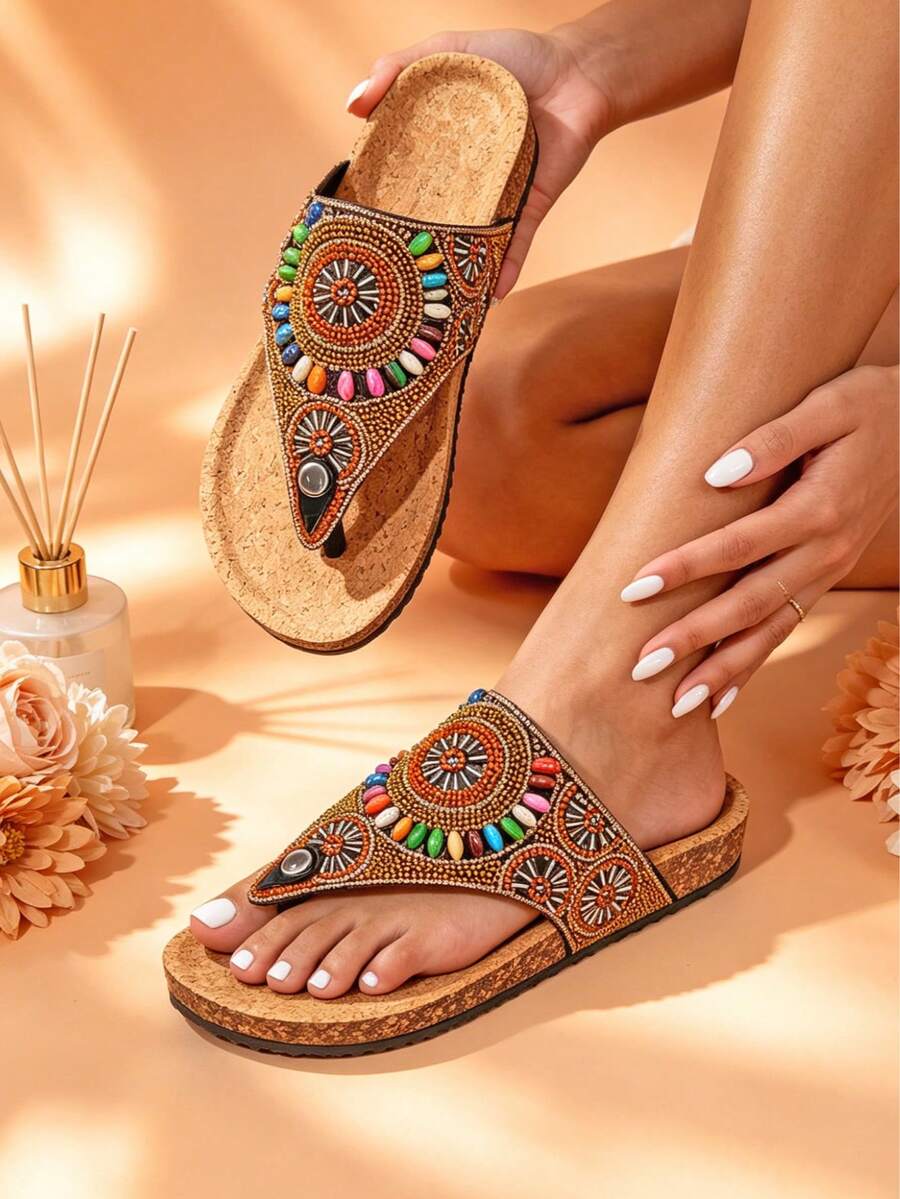 Top view of beaded V strap thong sandals with multicolor stones and metallic accents