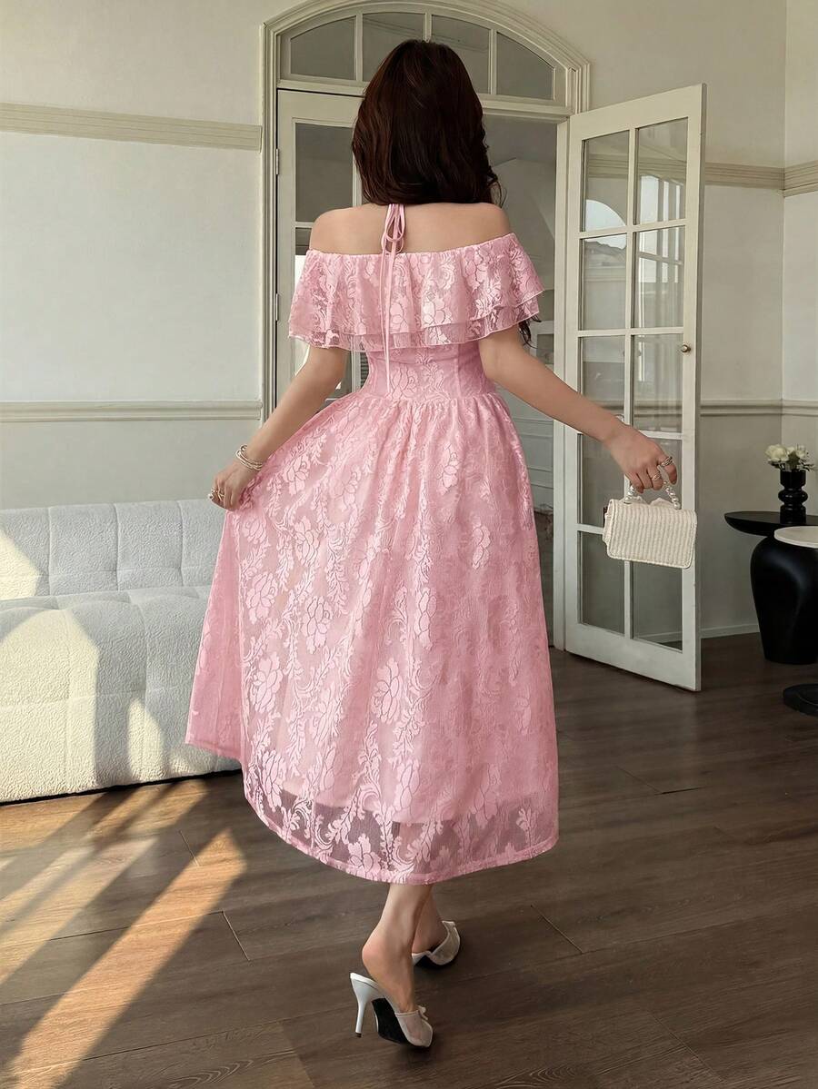 Back view of dusty pink floral ruffle midi dress with halter straps