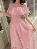Close view of dusty pink floral ruffled neckline and fitted midi dress