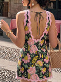 Back view of boho tie-back mini dress in multicolor print