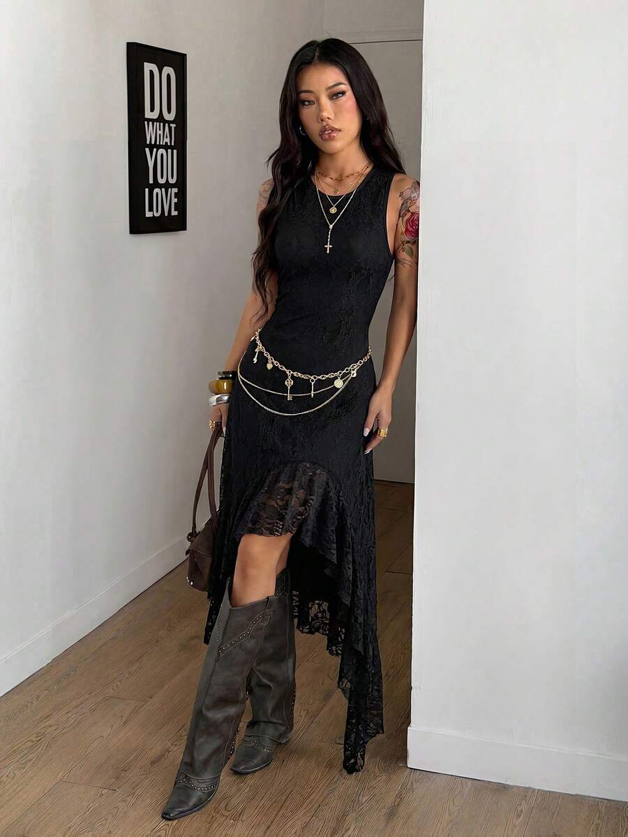 Angled view of black floral lace high-low dress showing fitted bodice and uneven hem