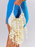 Ivory vacation shoulder bag with dense shell-disc sequins and fringe texture