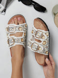 White frayed strap sandals with molded footbed and black tread outsole
