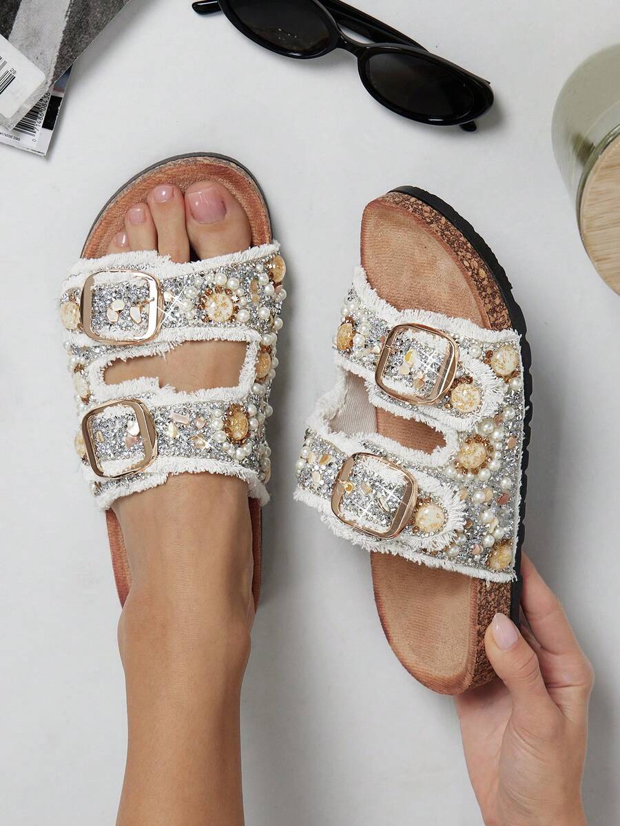 White frayed strap sandals with molded footbed and black tread outsole