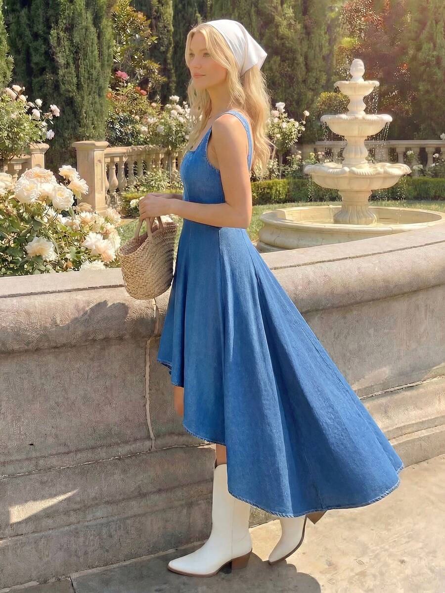 Front three-quarter view of blue square neck denim high-low dress styled outdoors