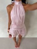 Full front view of light pink satin halter mini dress with layered skirt