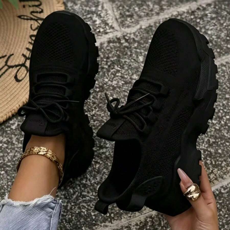 black knit chunky sneakers image 1 showing visible product shape, material, color, print, strap, lace, sole, neckline, or hem details