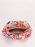 Open multicolor fabric clutch pouch showing pink zipper magnetic snap beige fabric lining and wide interior