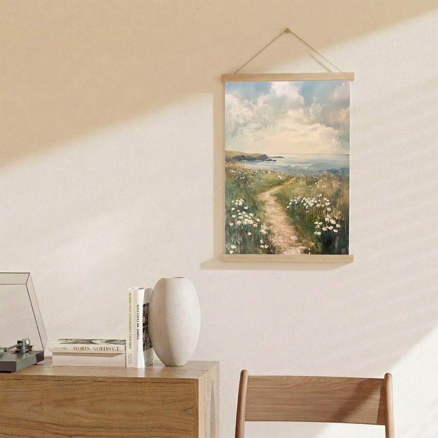 Shelf view of coastal wildflower canvas wall art with ocean path and light wood frame mockup