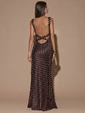 Back view of dark brown sleeveless deep V-neck maxi dress with crossed open back, shown for wedding and evening wear