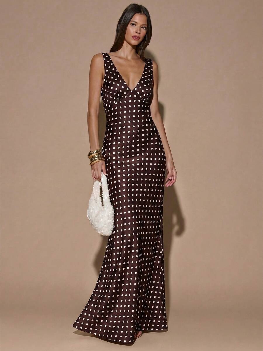 Front view of dark brown with white polka dots sleeveless deep V-neck maxi dress with crossed open back, shown for wedding and evening wear