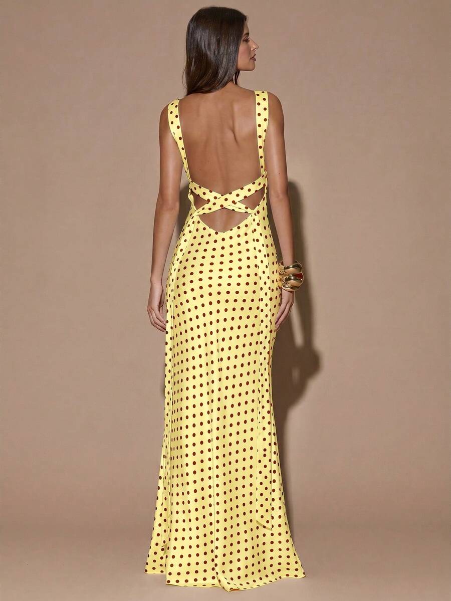 Back view of yellow with dark polka dots sleeveless deep V-neck maxi dress with crossed open back, shown for wedding and evening wear