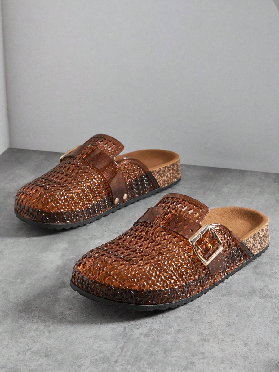Front three-quarter view of amber-brown woven clog mules