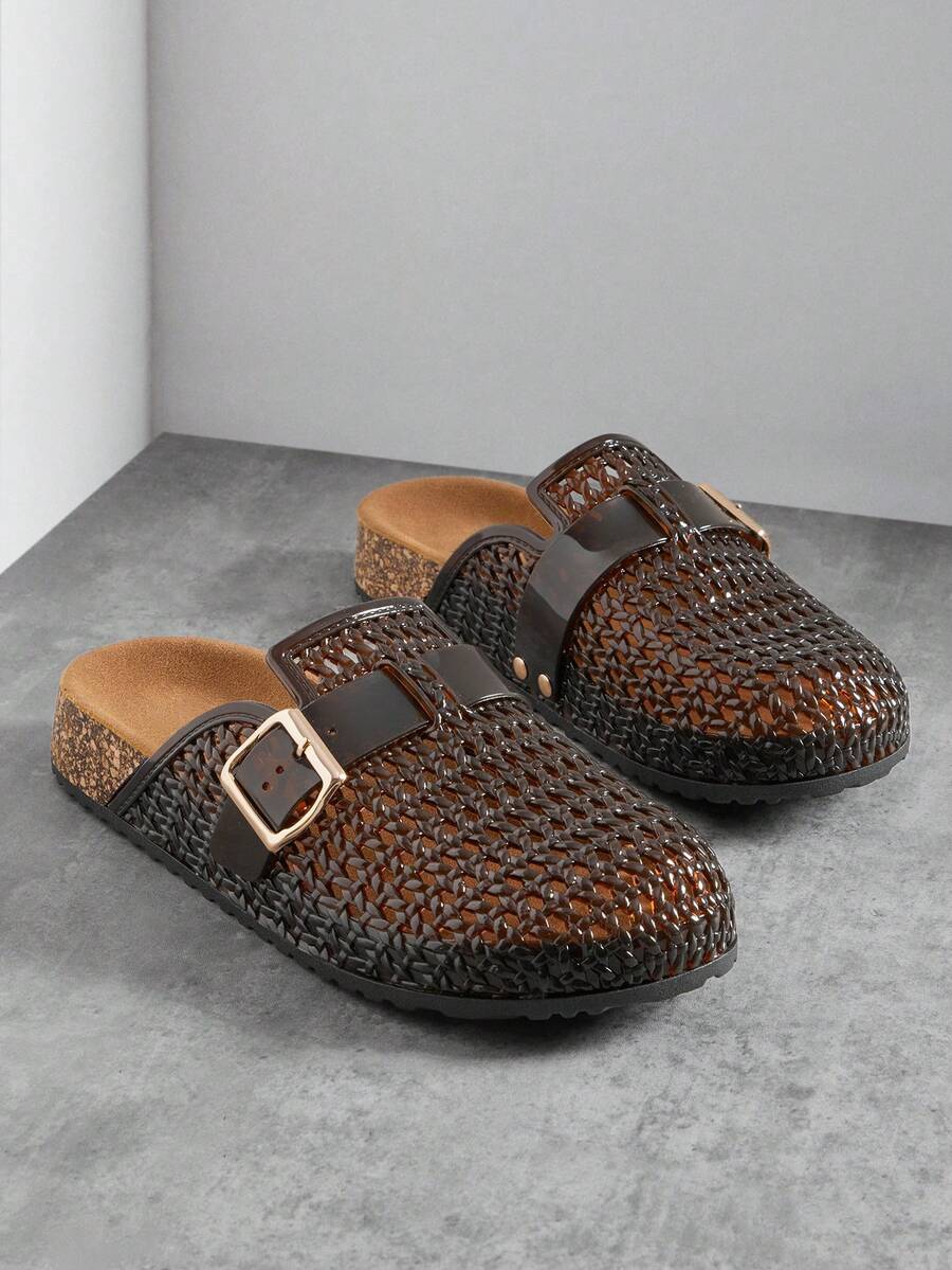 Front three-quarter product view of black-brown woven clog mules