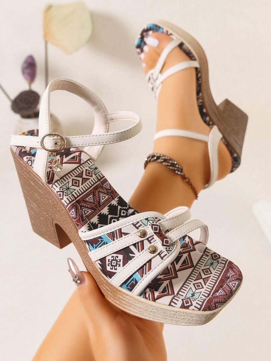 Beige boho platform sandal worn on foot with tribal print footbed and buckle strap