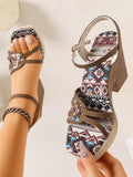 Front view of brown bohemian platform sandal with geometric print footbed