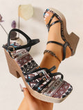Black platform wedge sandal worn on foot with tribal print insole