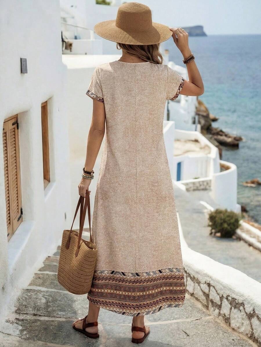 Beach view of beige border print maxi dress with relaxed boho shape