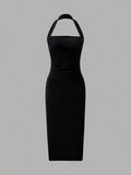 Back view black halter midi dress