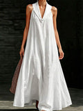 Front view of white crinkle texture maxi dress with deep V lapel collar