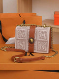 Back view of black retro crossbody bag with leather-look panel