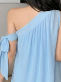 Close detail view of light blue one-shoulder A-line mini dress showing visible color, print, and silhouette
