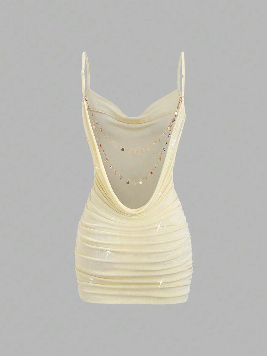Cadet blue backless mini dress with spaghetti straps and bodycon shape