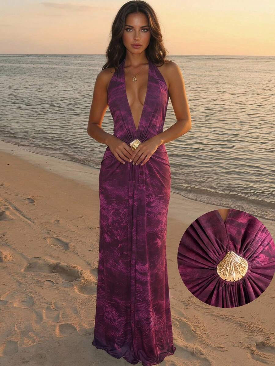 Beach view of purple printed halter maxi dress with shell waist detail