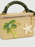 Side view of straw box crossbody bag with gold hardware and chain strap