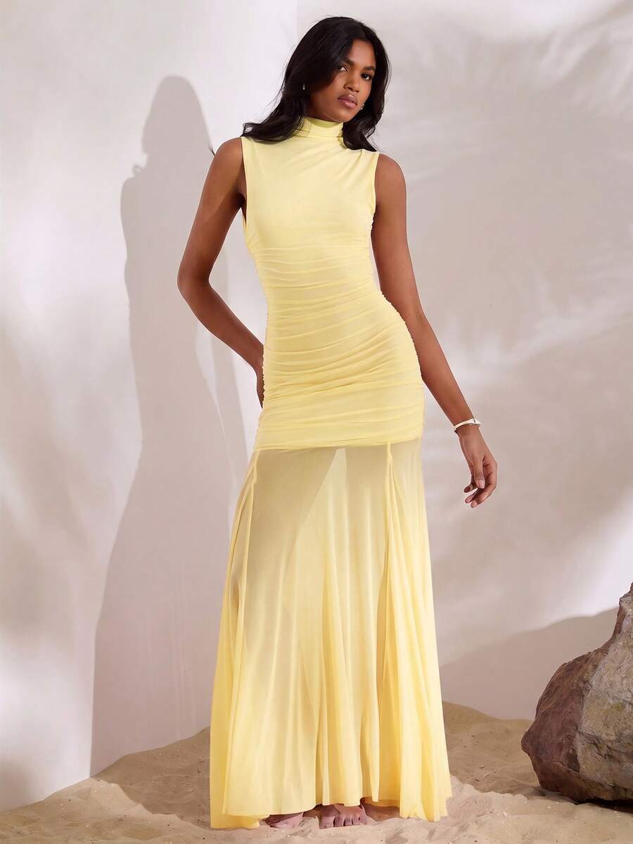 Yellow sheer flared maxi dress back view