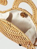 Side view of straw whale novelty handbag with rigid woven body